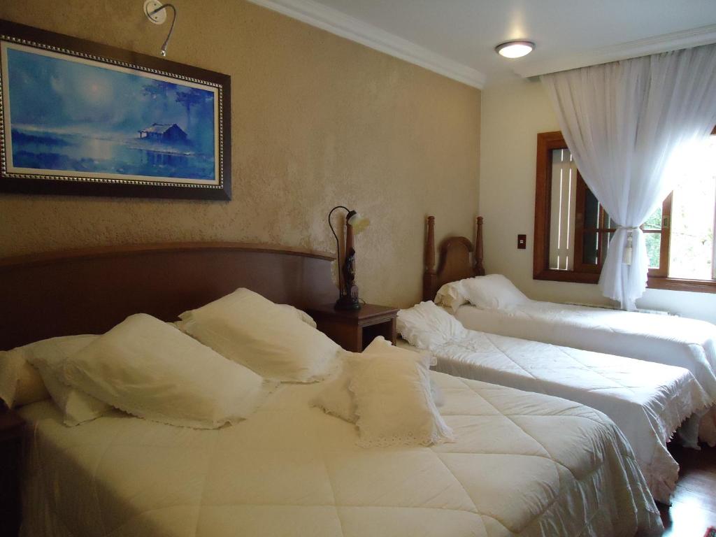 Postel nebo postele na pokoji v ubytování Hotel Pousada Florença