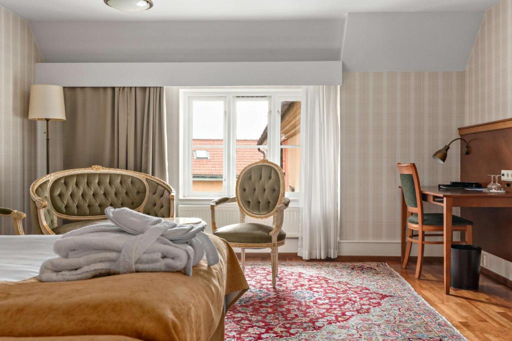 Postel nebo postele na pokoji v ubytování Best Western Strand Hotel