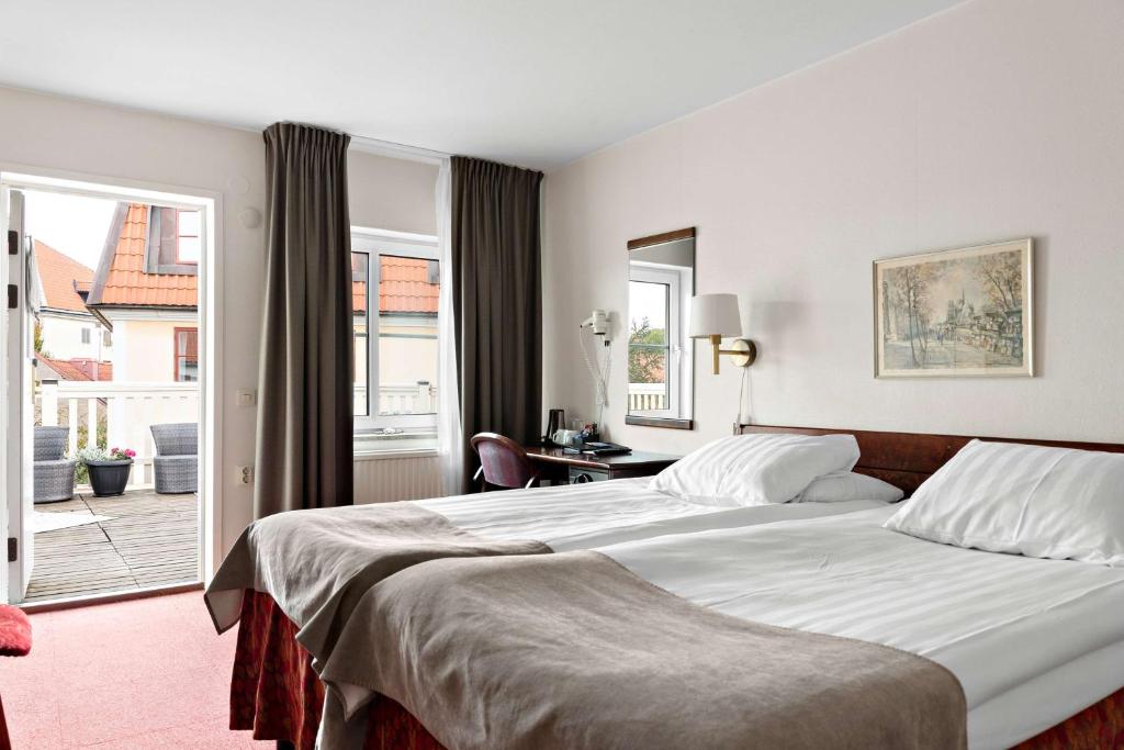 Postel nebo postele na pokoji v ubytování Best Western Strand Hotel