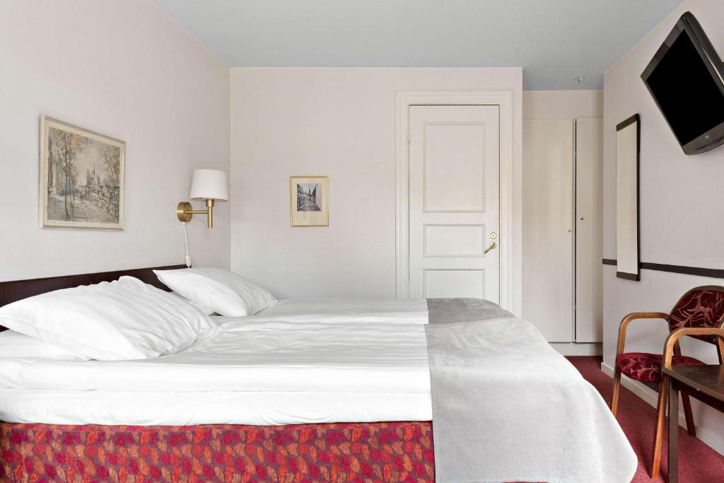 Postel nebo postele na pokoji v ubytování Best Western Strand Hotel