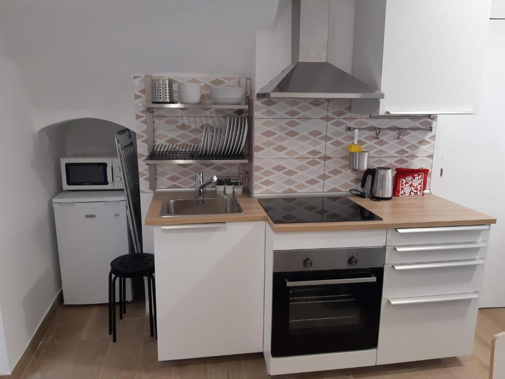 Kuchyň nebo kuchyňský kout v ubytování Lucky House
