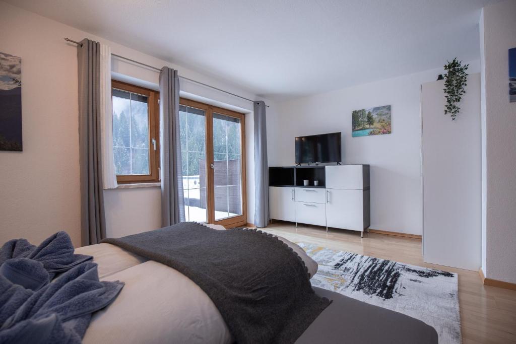 A television and/or entertainment centre at Sportapart Schweighofer Ski-in & Ski-out