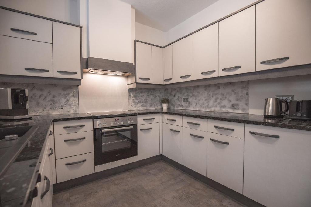 A kitchen or kitchenette at Sportapart Schweighofer Ski-in & Ski-out