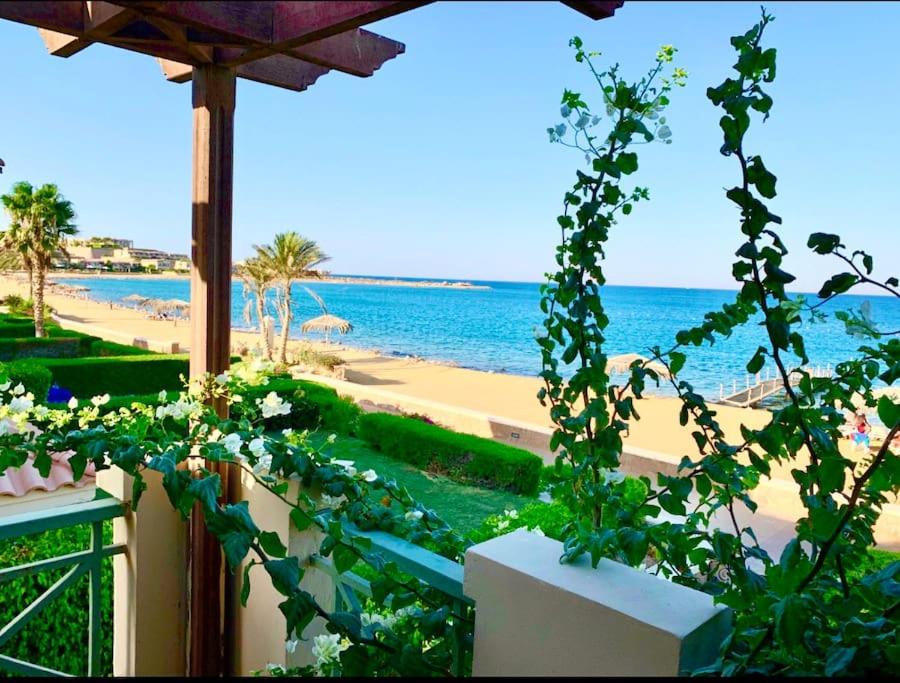 a view of the beach from the balcony of a resort at Amazing Beachfront townhouse chalet Ain Sokhna LaVista 1 in Ain Sokhna