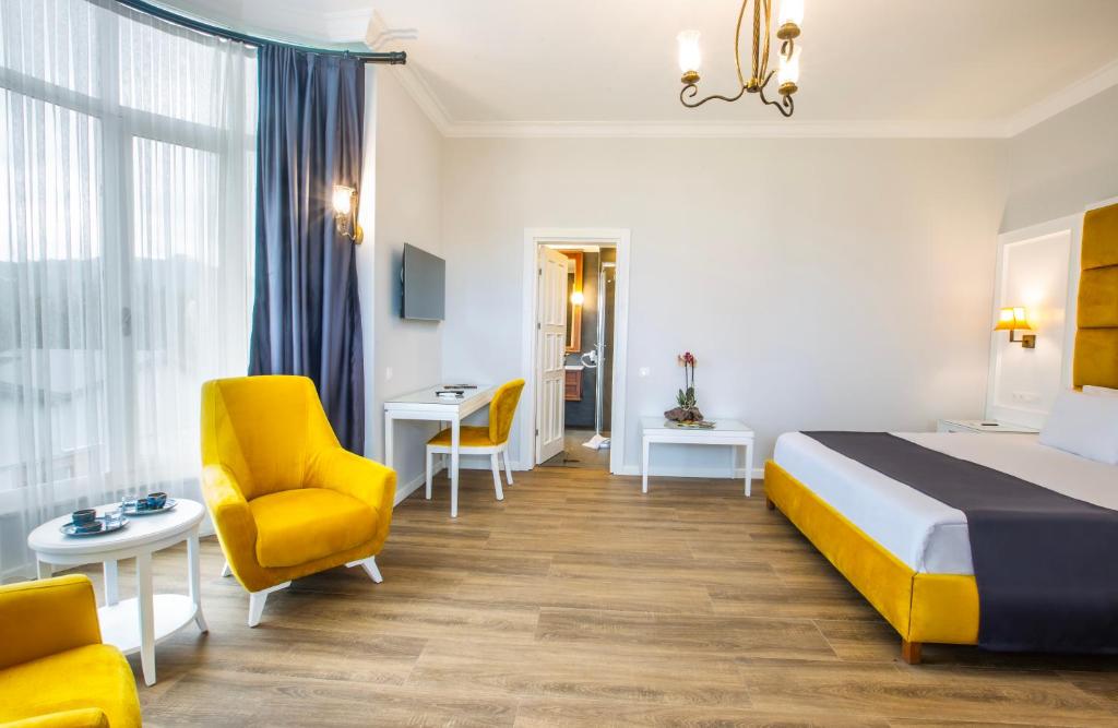 Postel nebo postele na pokoji v ubytování Zanike hotel