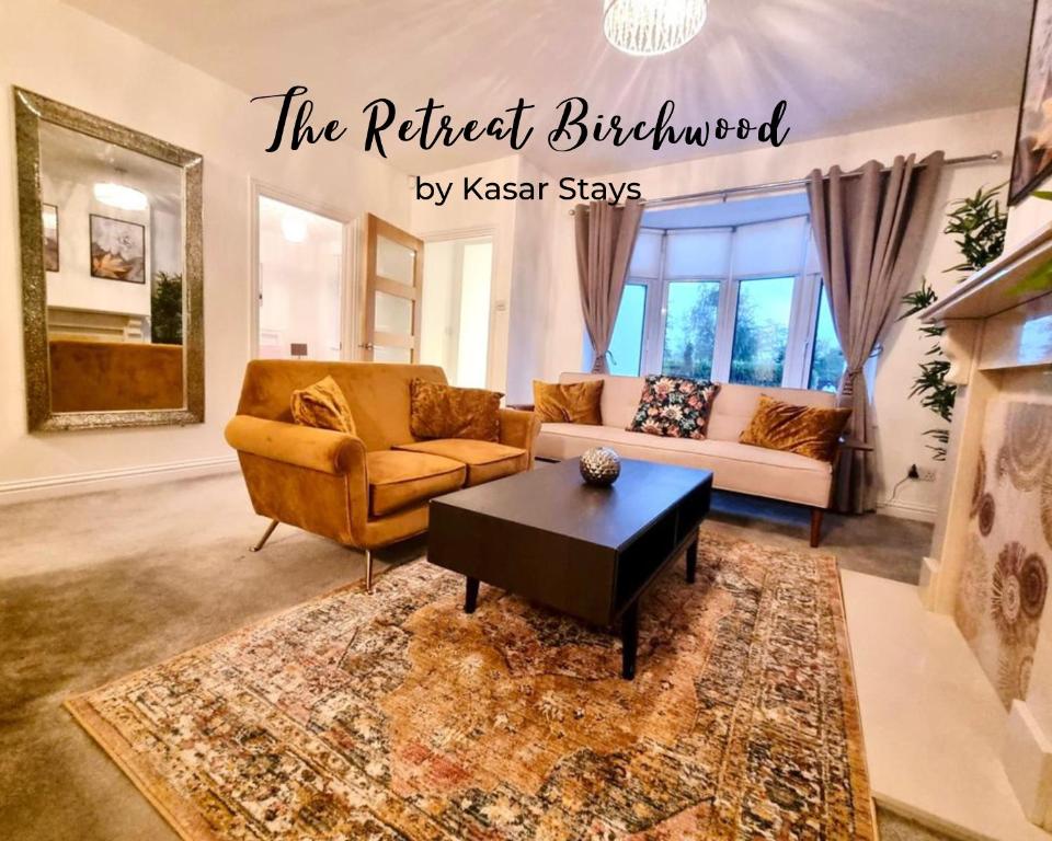 a living room with a couch and a coffee table at The Retreat Birchwood by Kasar Stays in Kent