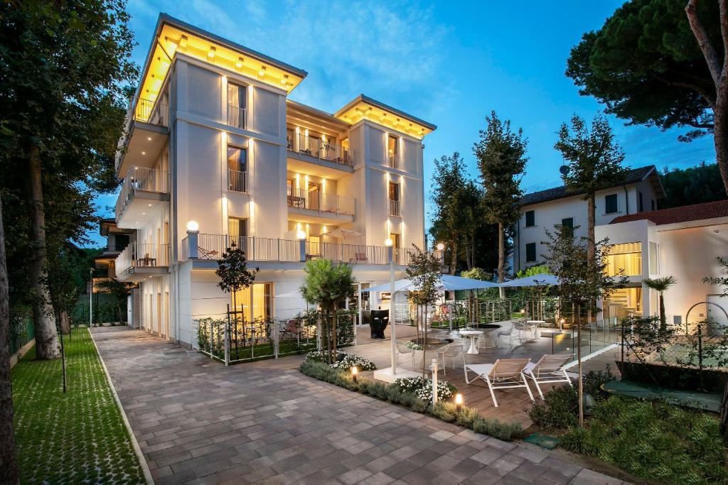 an exterior view of a building with a patio at Elegance Riccione in Riccione