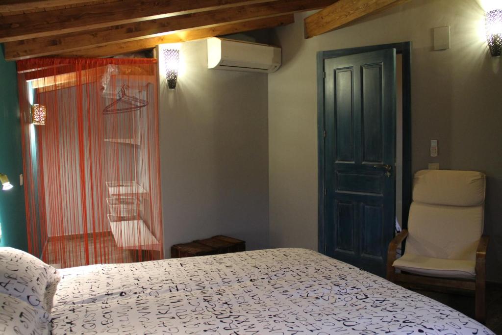 Postel nebo postele na pokoji v ubytování Casa Rural El Peral