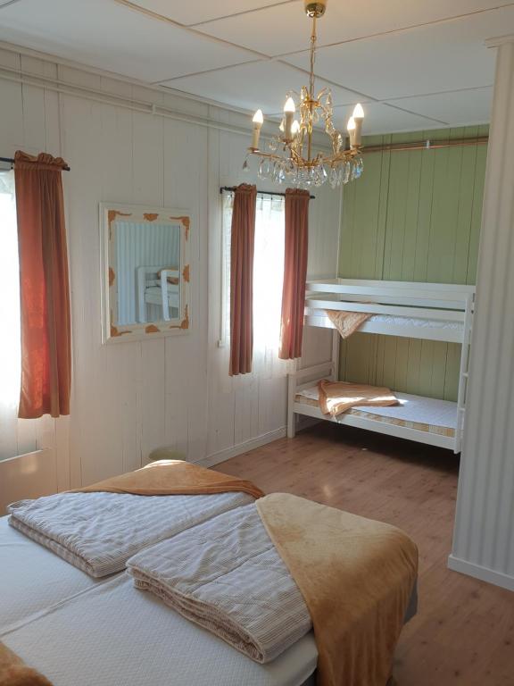Postel nebo postele na pokoji v ubytování Valle vandrarhem och camping