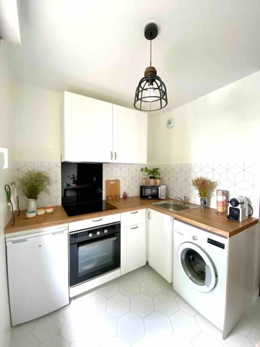 Kuchyňa alebo kuchynka v ubytovaní Mon cocoon toulousain cosy appartement idéalement situé