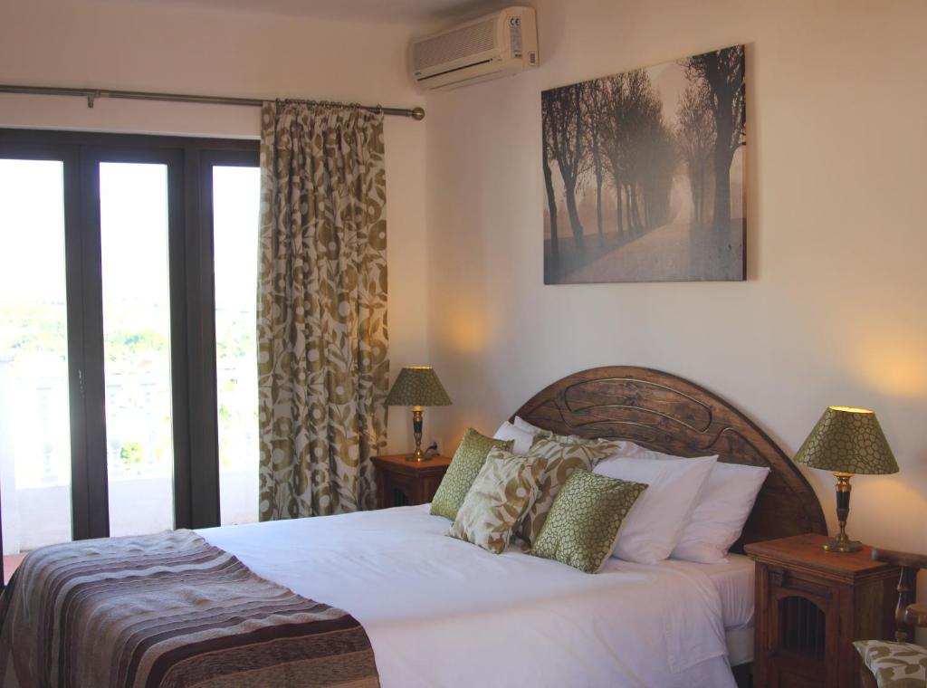 Postel nebo postele na pokoji v ubytování Hostal Avalon