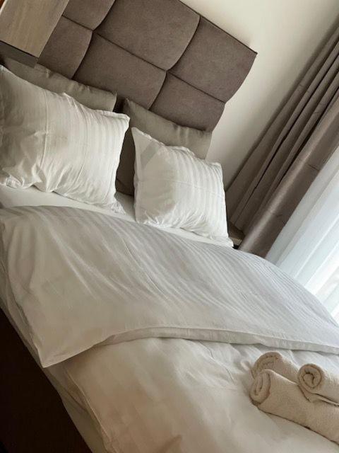 Postel nebo postele na pokoji v ubytování Perla Lux apartmani