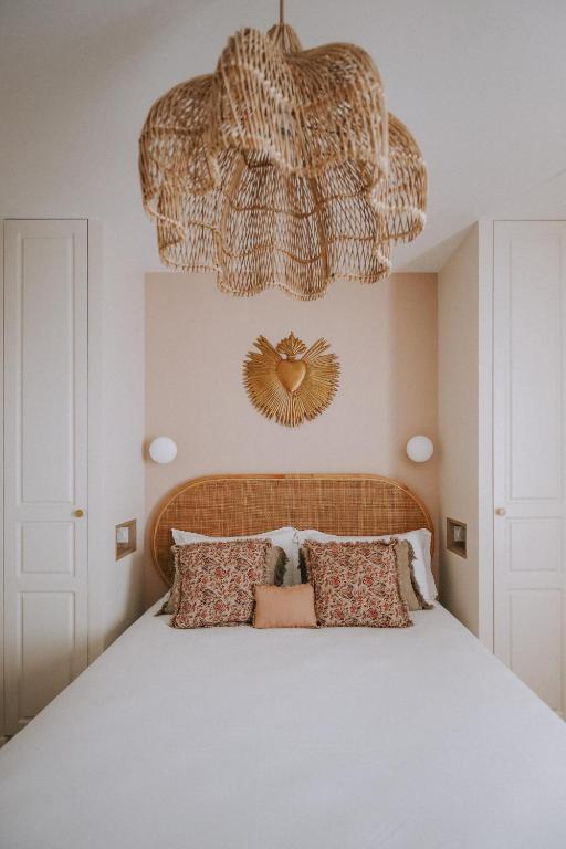 Łóżko lub łóżka w pokoju w obiekcie Sézam-Appart-Hôtel