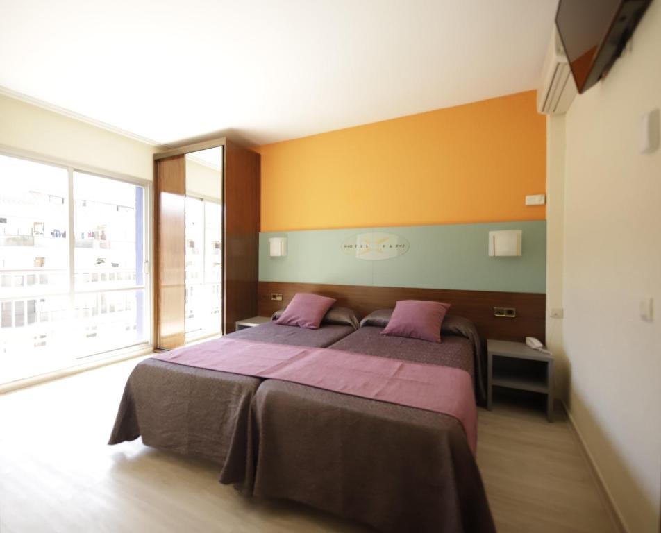 Postel nebo postele na pokoji v ubytování Hotel Papi