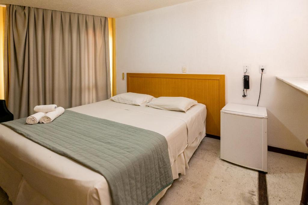 Postel nebo postele na pokoji v ubytování Safari Natal Beach Hotel