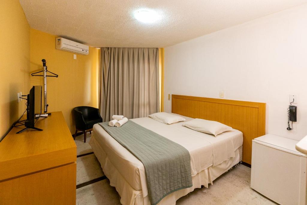 Postel nebo postele na pokoji v ubytování Safari Natal Beach Hotel
