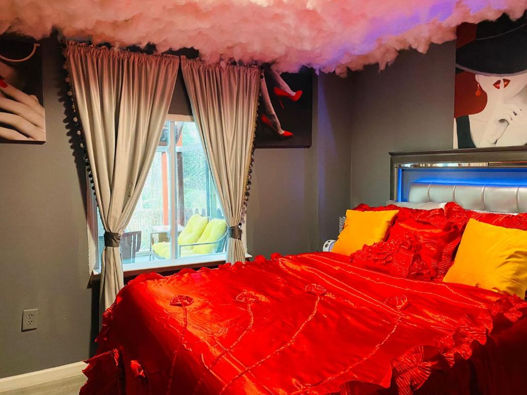 En eller flere senge i et værelse på Sweet Home Georgia Passionne