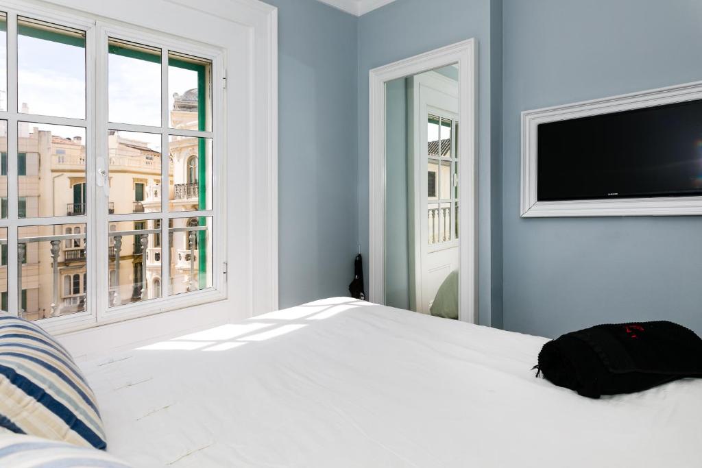 Posteľ alebo postele v izbe v ubytovaní weforyou 2 BEDROOMS PENTHOUSE AT MALAGA CENTER