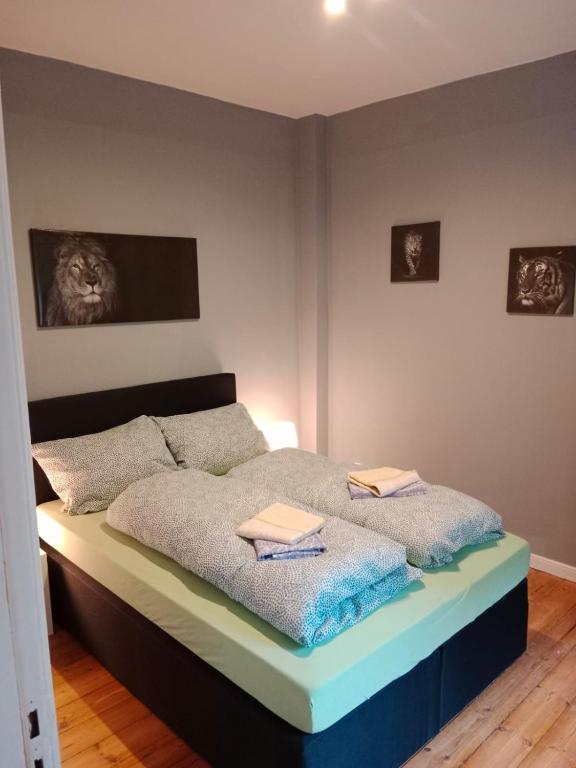 a bedroom with a bed with two towels on it at Flensburg Zentrum 50 05 in Flensburg
