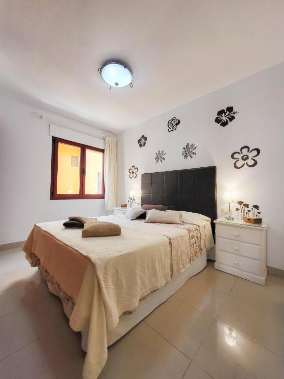 Posteľ alebo postele v izbe v ubytovaní MEDANO4YOU Red Mountain Sea View Holiday Home