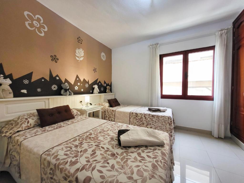 Posteľ alebo postele v izbe v ubytovaní MEDANO4YOU Red Mountain Sea View Holiday Home