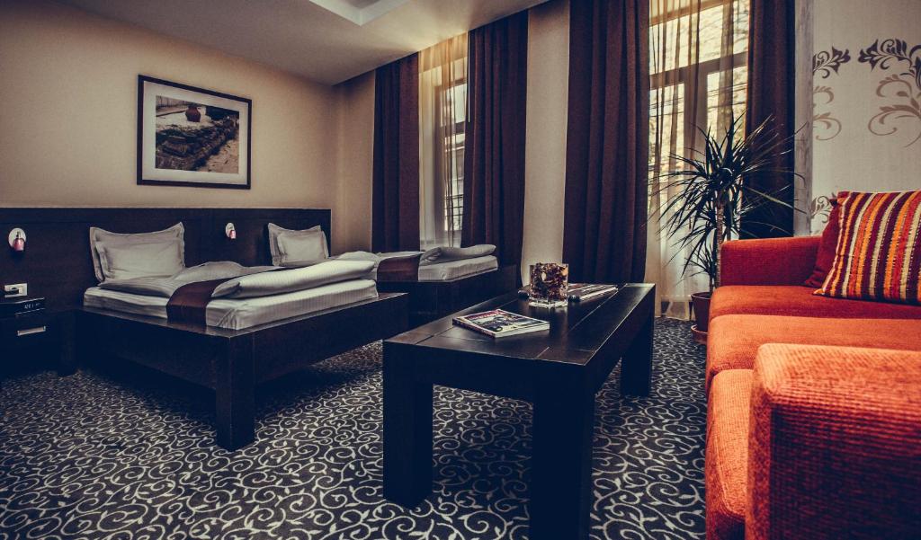 Postel nebo postele na pokoji v ubytování Hotel Cherica