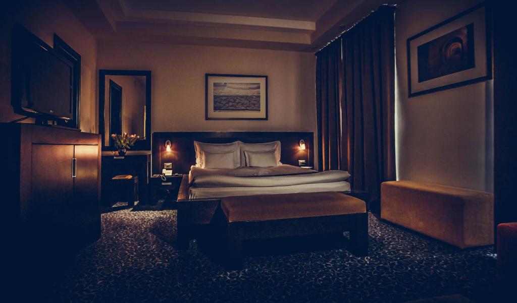 Postel nebo postele na pokoji v ubytování Hotel Cherica
