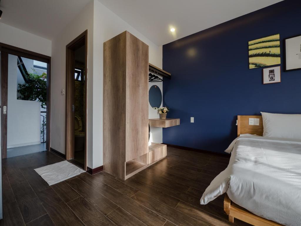 Ein Bett oder Betten in einem Zimmer der Unterkunft Wings House