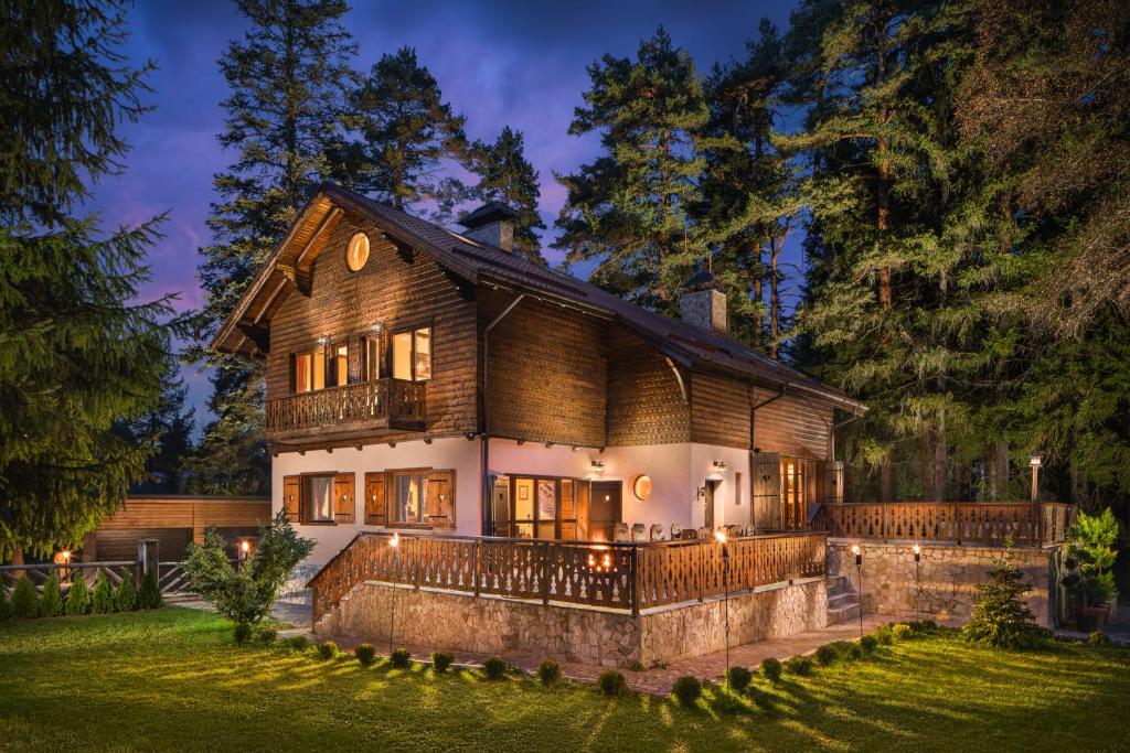 a large house with a fence in the yard at Villa Borovets Mountain & Luxury in Borovets