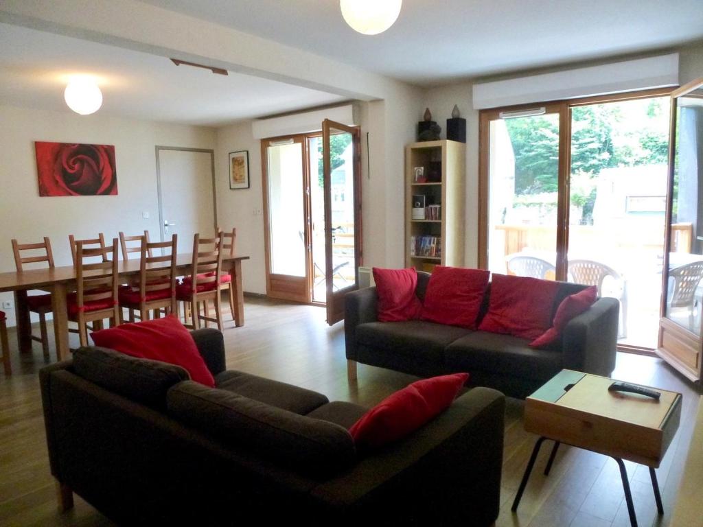 a living room with two couches and a dining room at Boost Your Immo Bois De Marie Barèges PM9 in Barèges