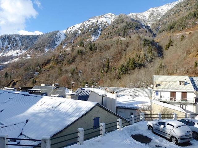 a car parked in a parking lot in front of a mountain at Boost Your Immo Artigalas Barèges PM11 in Barèges