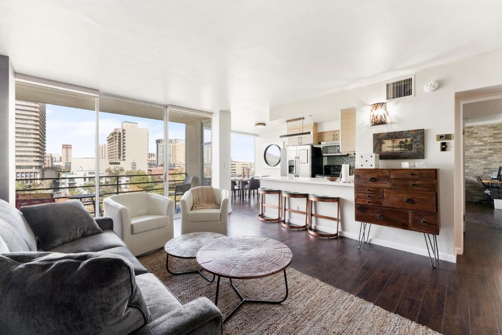 a living room with a couch and a kitchen at Panorama Place in Reno