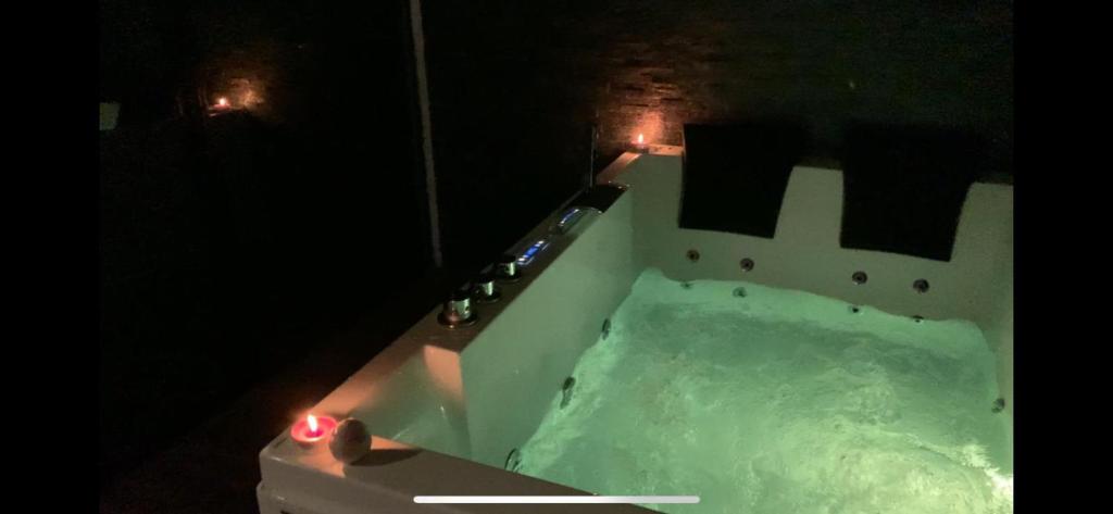 a bath tub filled with snow at night at Suite pour les Amoureux_Val d'Europe Disney in Coupvray