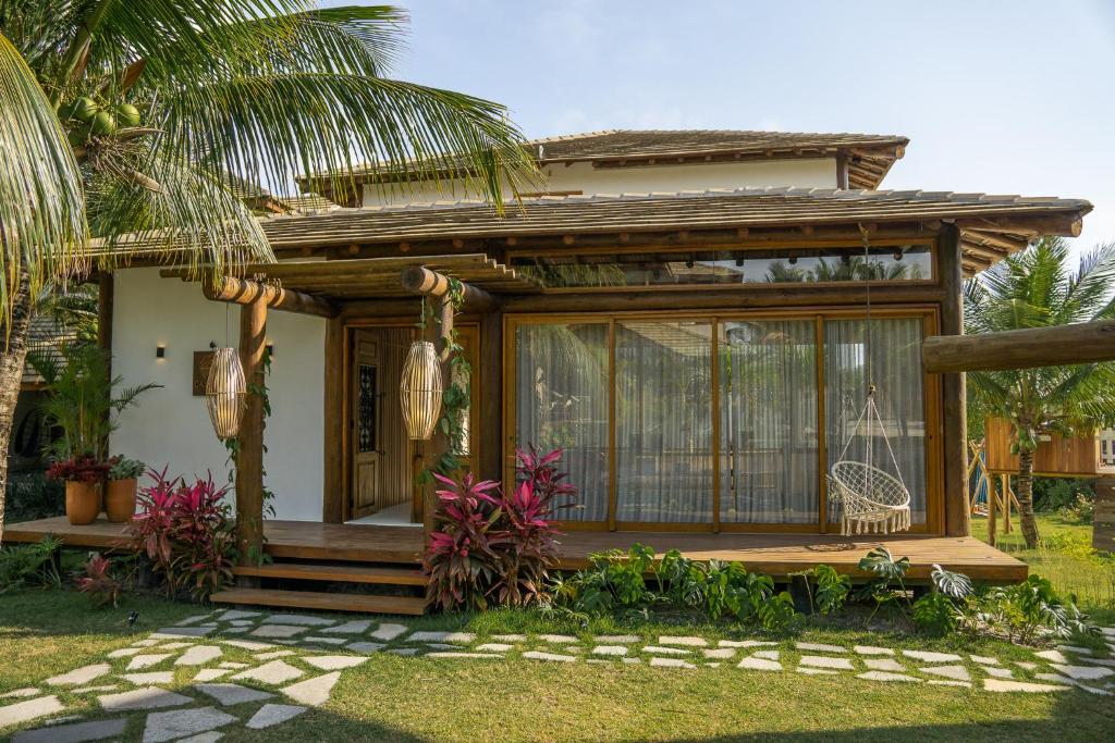 a small house with a screened in porch at Casa Kai 