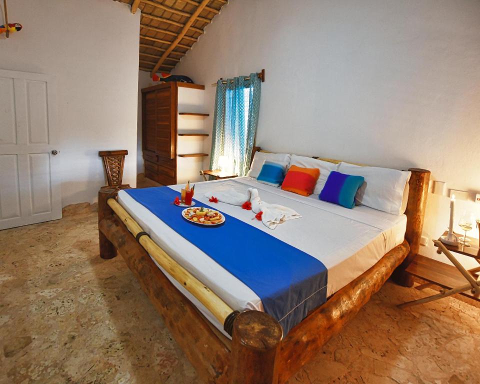 Postel nebo postele na pokoji v ubytování Paradiso del Caribe