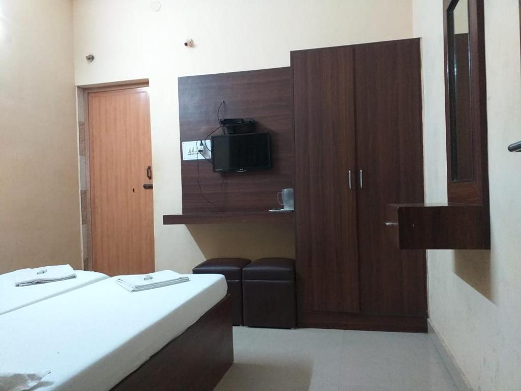 Postel nebo postele na pokoji v ubytování PLAZA GUEST HOUSE