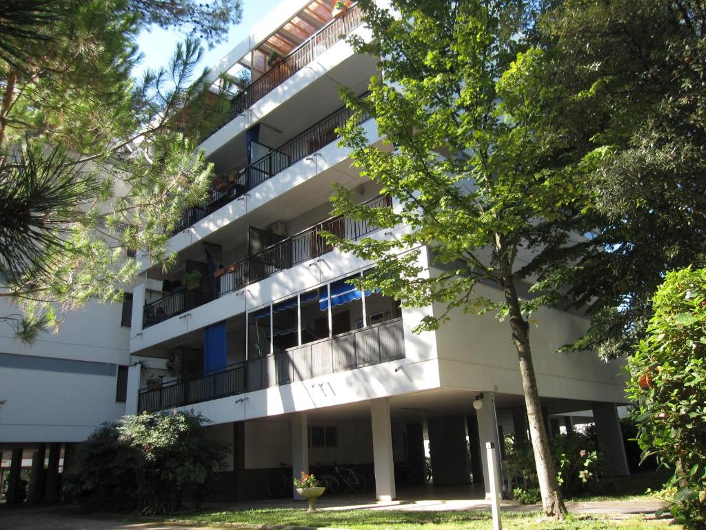 an external view of a building with trees in the foreground at Argea in Grado