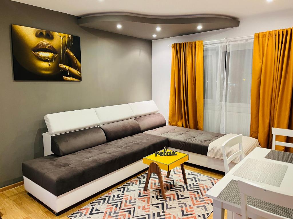 a living room with a couch and a yellow table at Confort View Apartment Iași - 3 rooms-Like Home in Iaşi