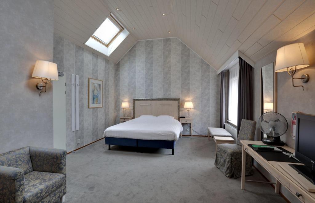 Postel nebo postele na pokoji v ubytování Landhotel De Hoofdige Boer