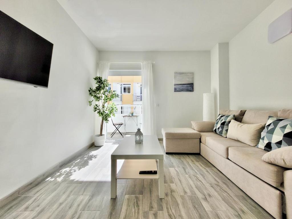 Telewizja i/lub zestaw kina domowego w obiekcie La Hoya 29 Apartments
