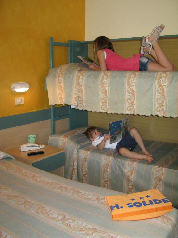Postel nebo postele na pokoji v ubytování Hotel Solidea