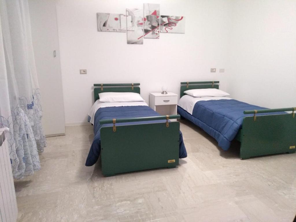 Letto o letti in una camera di Affittacamere Casa Quisquina