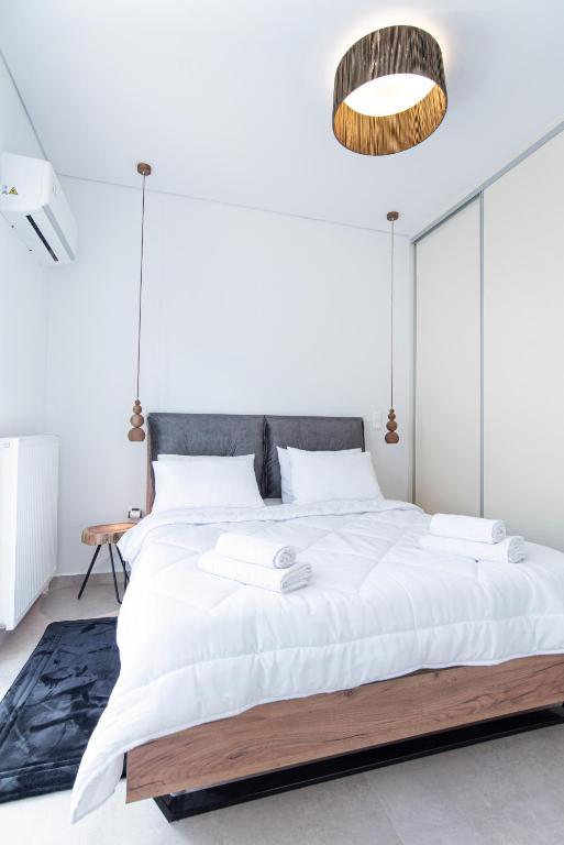 Posteľ alebo postele v izbe v ubytovaní 2bdroom Plaka Apartment
