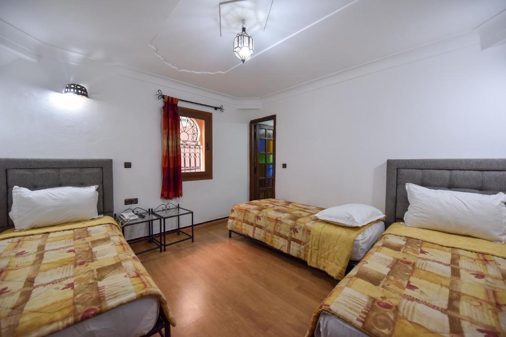 Postel nebo postele na pokoji v ubytování Riad Assia