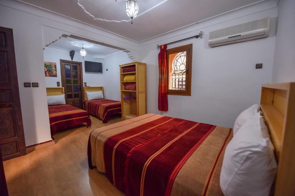 Postel nebo postele na pokoji v ubytování Riad Assia