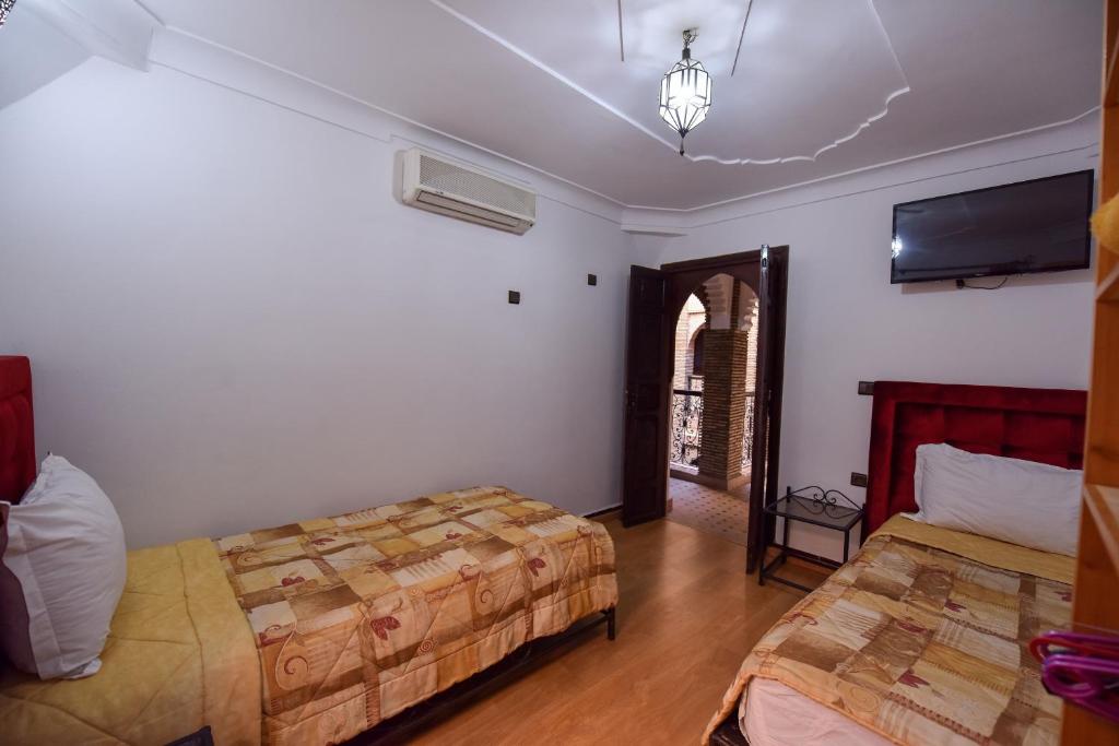 Postel nebo postele na pokoji v ubytování Riad Assia