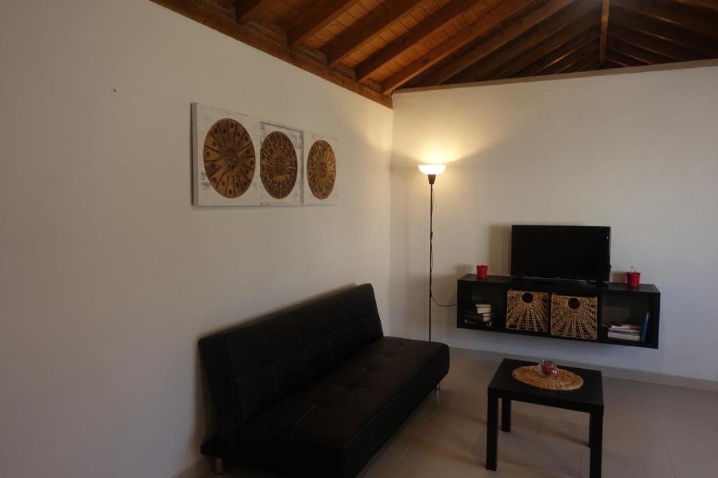 Televízia a/alebo spoločenská miestnosť v ubytovaní Galwey, tourist appartments with WIFI