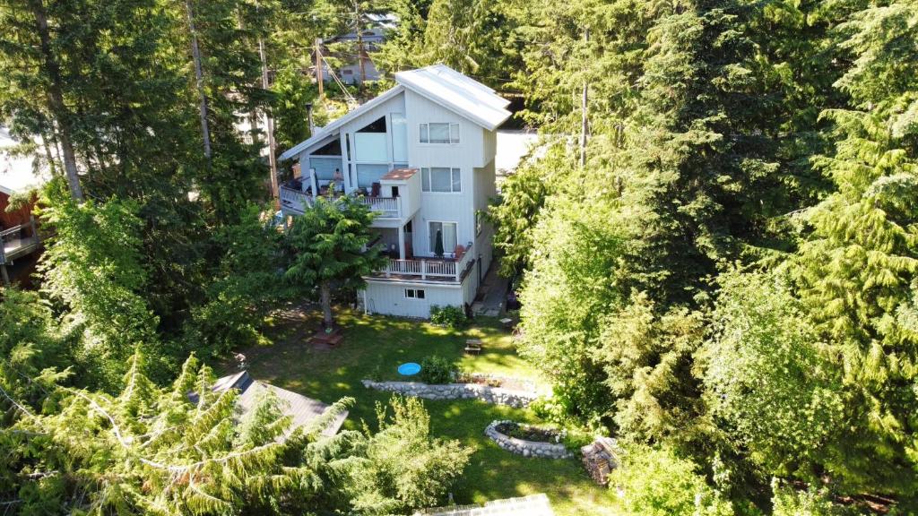 an aerial view of a white house in the woods at Belle Neige Whistler in Whistler
