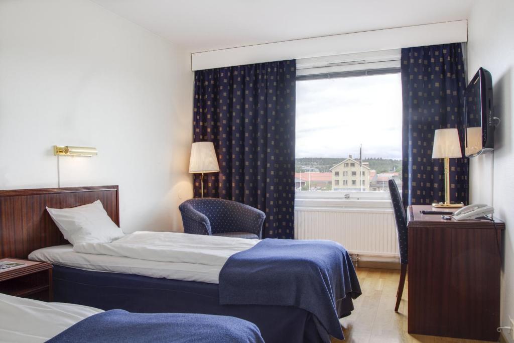 Postel nebo postele na pokoji v ubytování First Hotel Stadt