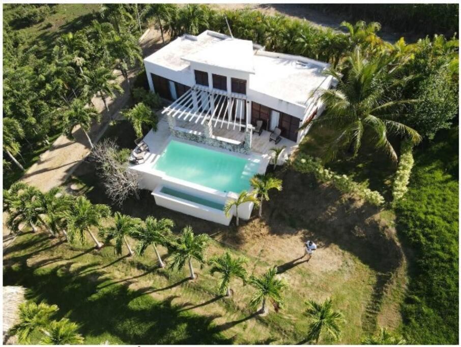 an aerial view of a house with a swimming pool at VistaLinda, Villa Alamendra in Río San Juan